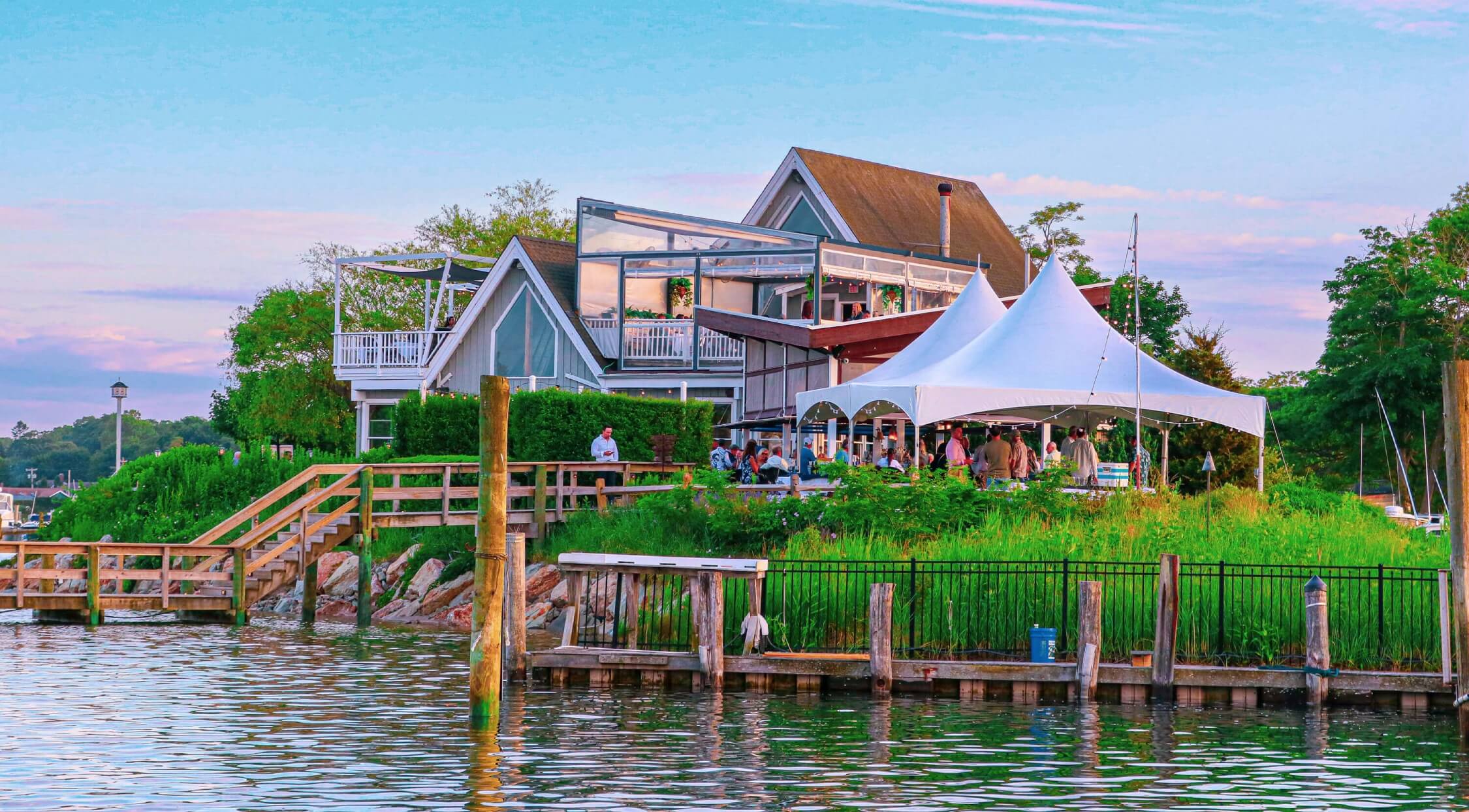 Cowfish Restaurant and Bar with outdoor waterfront bar seating near Hampton Bays