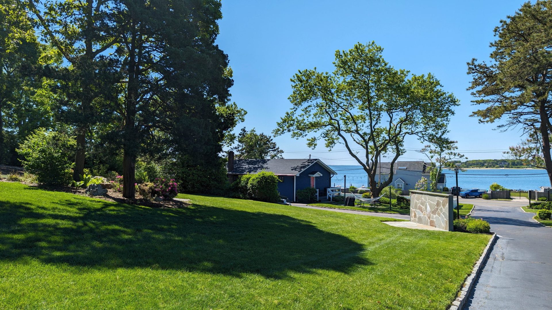 Grass-filled terrace for tented receptions under the stars at Ocean View Terrace Inn
